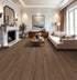 COREtec CR506 Coastal Luxe luxury vinyl plank flooring in modern living room bourbon maple