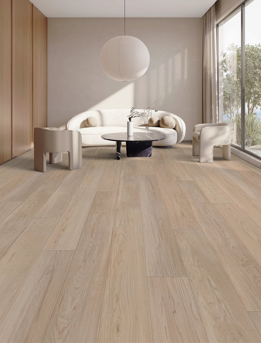 COREtec CR506 luxury vinyl plank Coastal Luxe CR506 Vanalla grove maple Room Scene showing Modern living room with wooden flooring, white walls, and a large window.