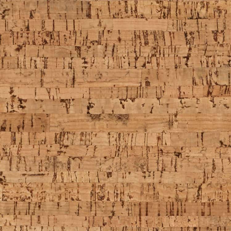 Wicanders Cork Go Whim close-up texture of natural cork material, showing a warm tan and brown color with a rough, fibrous grain pattern.