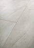 COREtec CRT01 Natural Opula Opal Travertine waterproof luxury vinyl tile close-up soft pale ivory travertine stone veining 18x36