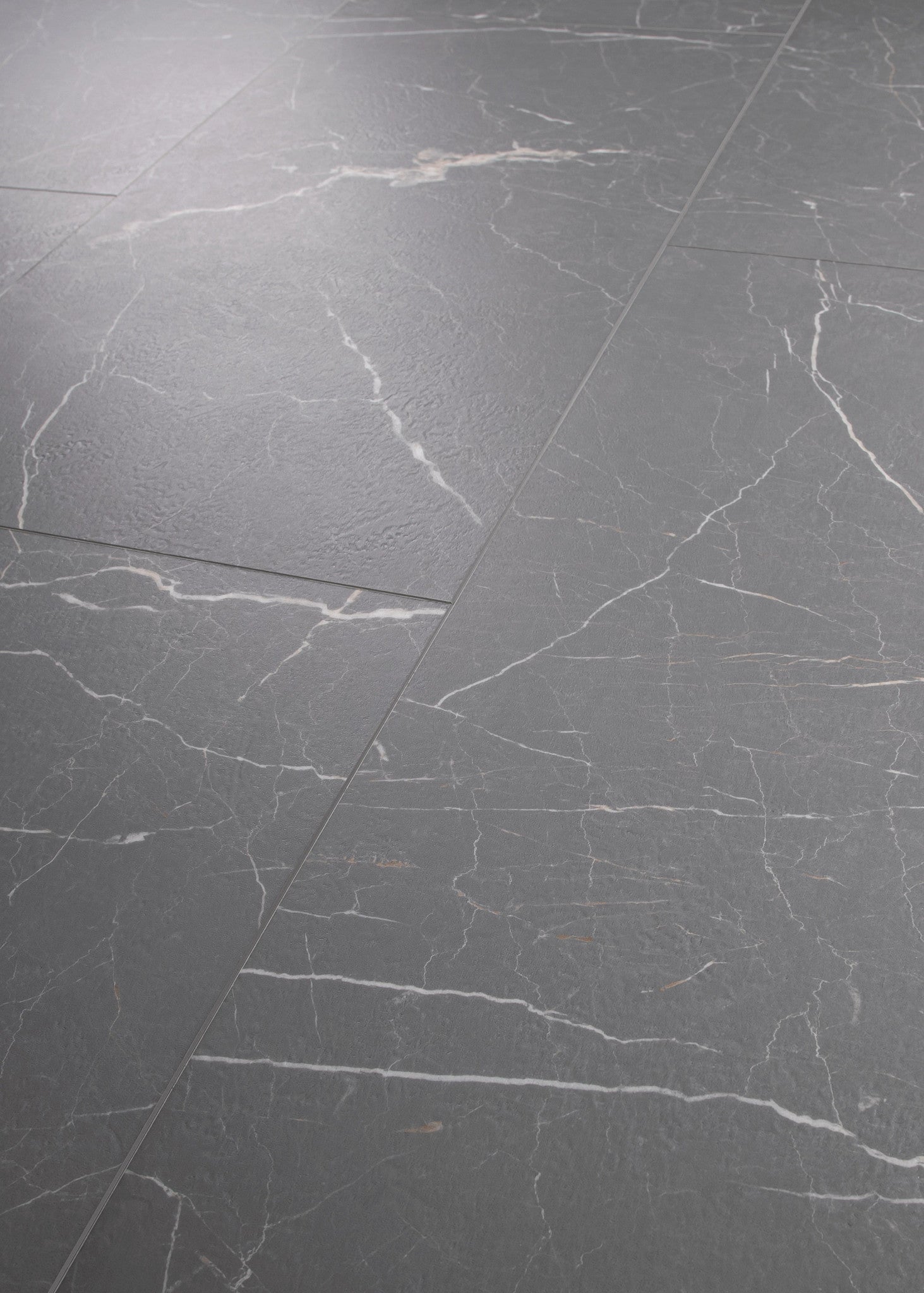 COREtec CRT01 Natural Opula Graphite Travertine 18" x 36" vinyl tile, angled view