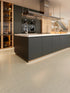 COREtec CRT02 Balanced Retreat Soft Umber Concrete waterproof luxury vinyl tile installed in a room setting
