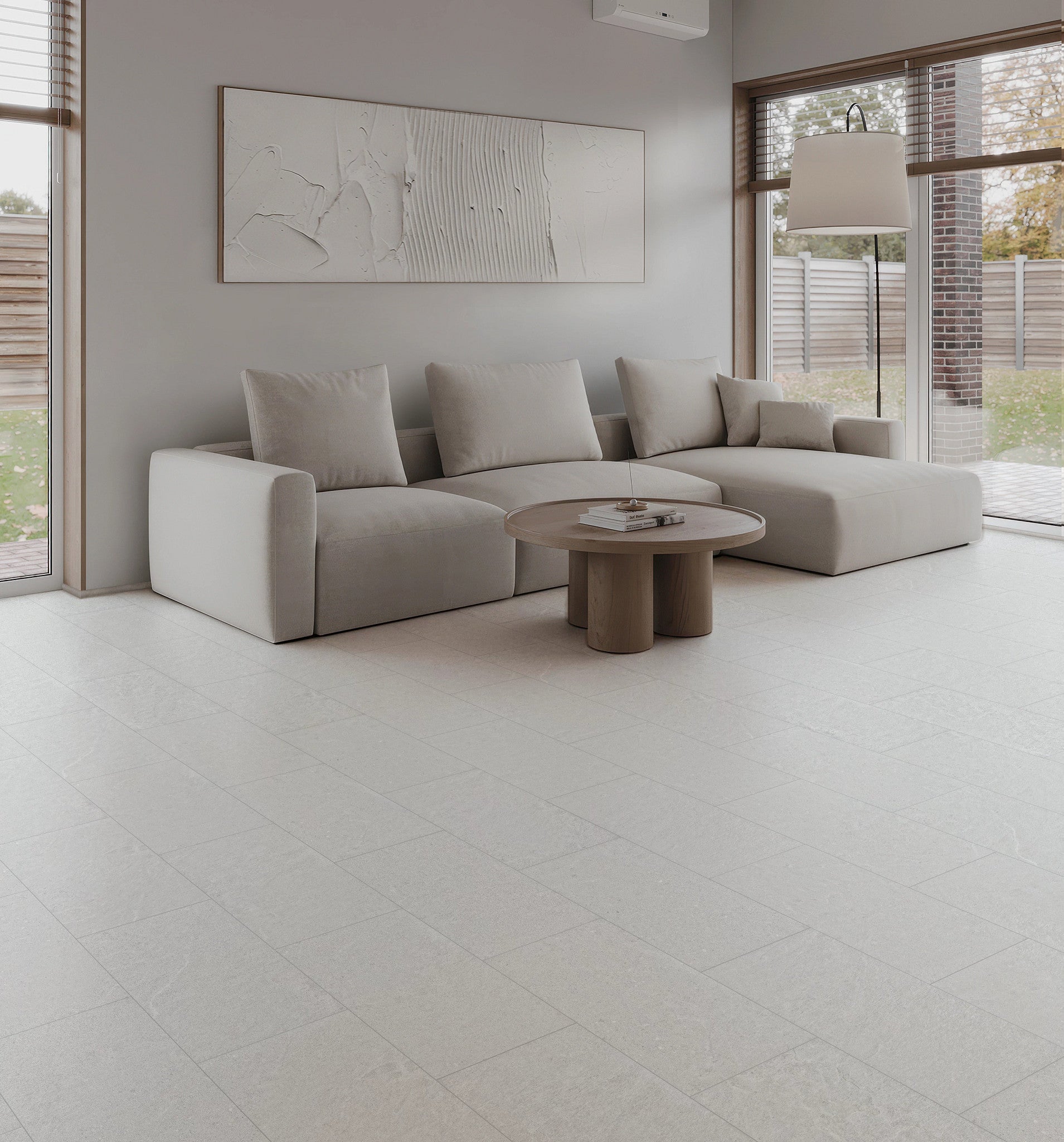 COREtec CRT02 Balanced Retreat Silver Mist Concrete waterproof luxury vinyl tile installed in a room setting